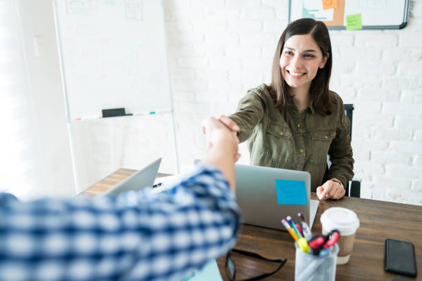 istock Business Partners Shaking Hands During A Meeting 1164703305