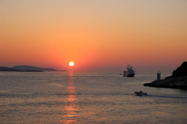 istock A Boat and a Ship close to Hvar / sunset 1164703507