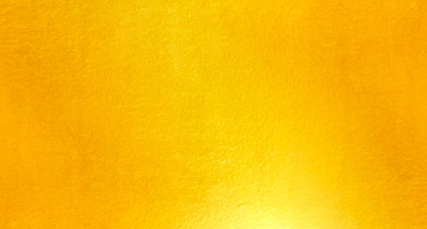 istock Shiny yellow leaf gold metal texture 1164704164