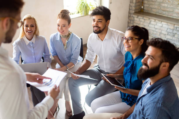 istock Business, technology and people concept - creative team or designers working in office 1164704189