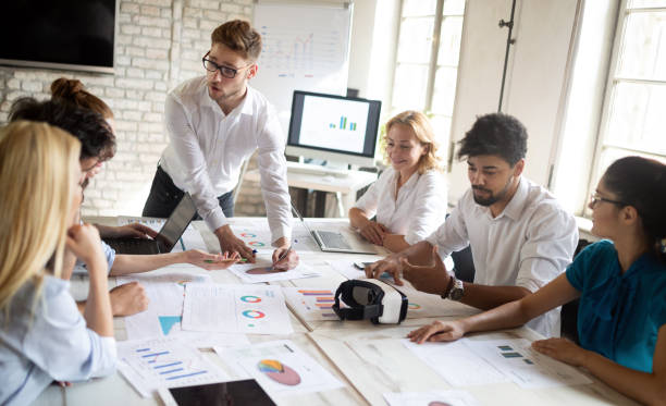istock Business, technology and people concept - creative team or designers working in office 1164704275