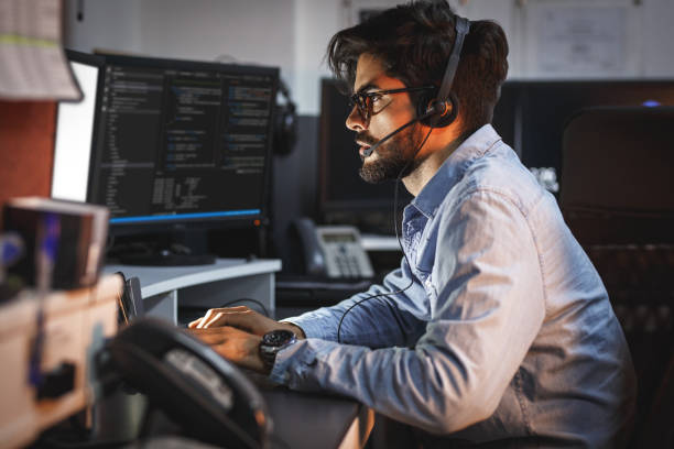 istock Male programmer working on new project.He working late at night at the office. 1164704602