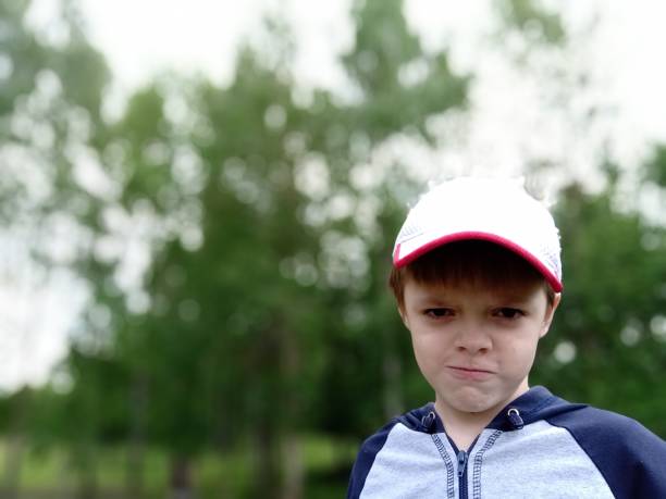 istock Angry boy outdoor portrait 1164704766