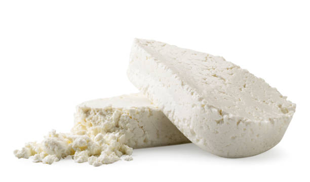istock Two pieces of cottage cheese close-up on a white. Isolated 1164704868