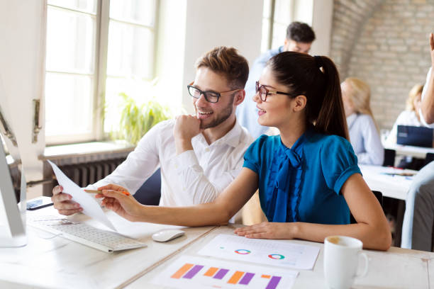 istock Business, technology and people concept - creative team or designers working in office 1164707443