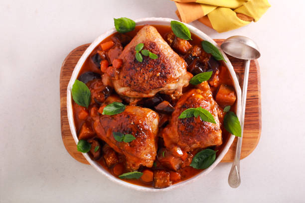 istock Chicken thighs with eggplant and carrot 1164708015