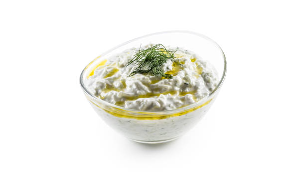 Tzatziki sauce in a glass bowl isolated on white background Tzatziki sauce in a glass bowl isolated on white background. tzatziki stock pictures, royalty-free photos & images