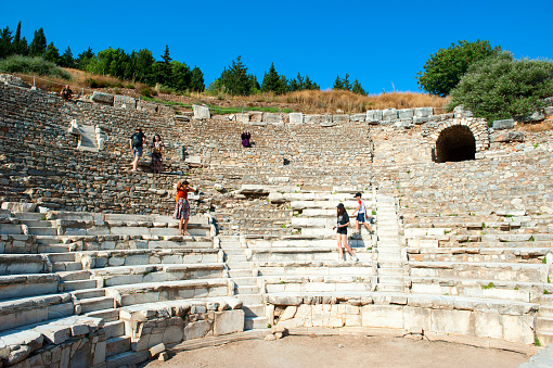Selcuk-Izmir, Turkey - June 22, 2019: People are visiting ODEON is the parliamentary building structure of the ancient period, Ephesus Ancient City in Izmir, Turkey