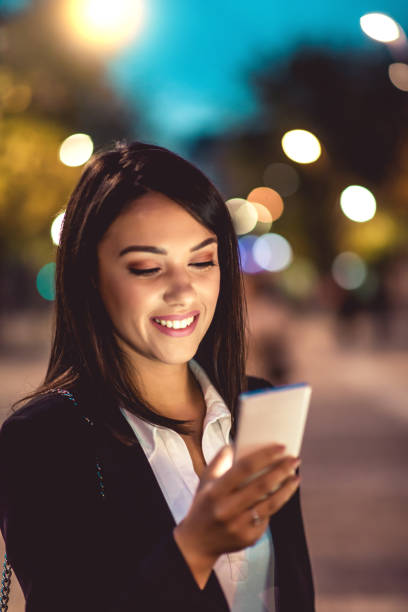 istock Happy woman using smartphone 1164723439