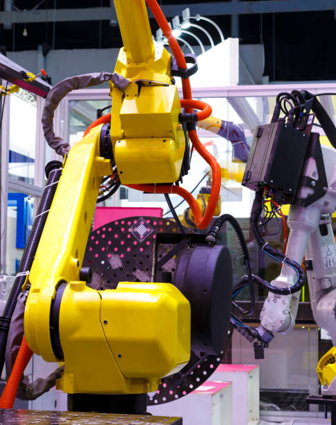 istock Close up industrial robotic arm with wires 1164725061