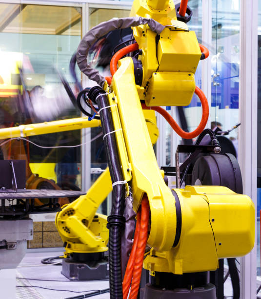 istock Moving part of robotic arm machine tool back view close up 1164725108