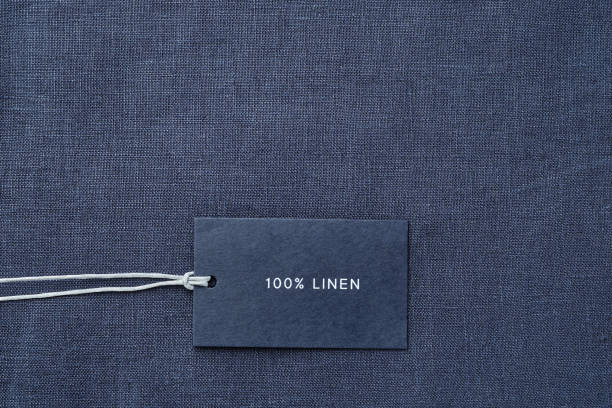 istock Label with composition of fabric on cloth background. 100% linen 1164727108