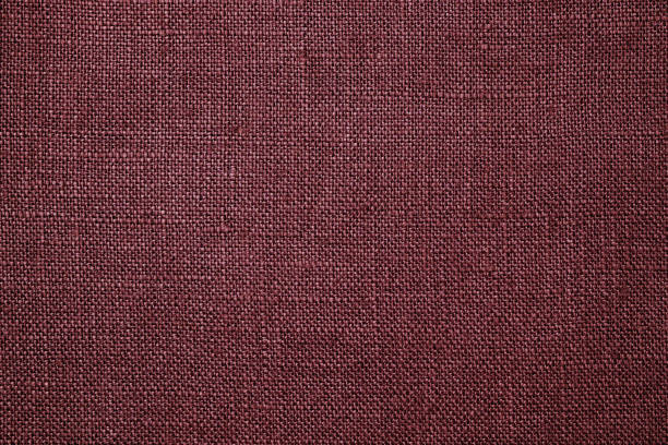 istock Fabric closeup. Dark red linen texture 1164727122