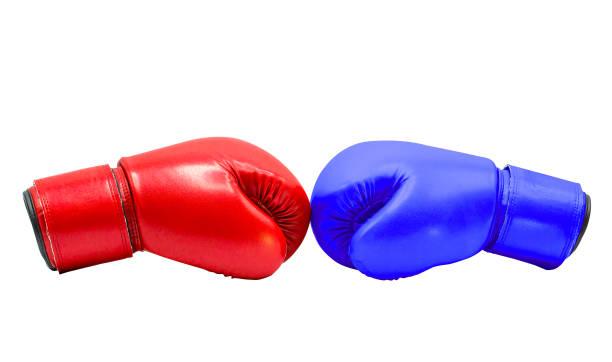 istock Boxing gloves Red and Blue hitting together isolated on white background with clipping path 1164727993
