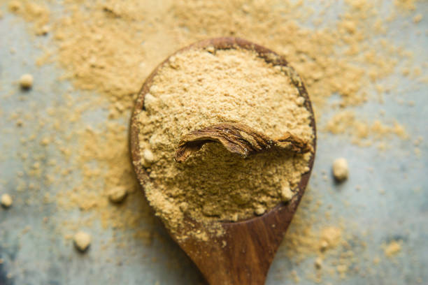 istock Close-up of dry mango powder and dry mango 1164729154