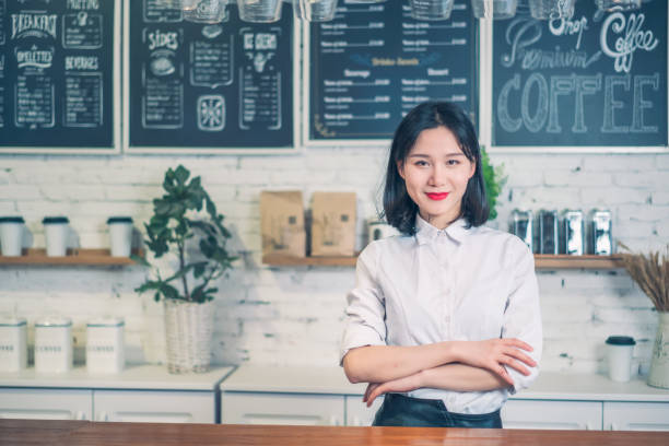 istock Manager of tea and coffee store in her shop 1164730099