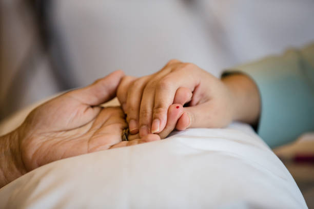 istock Process of drawing blood from a finger for hematocrit test. 1164731390
