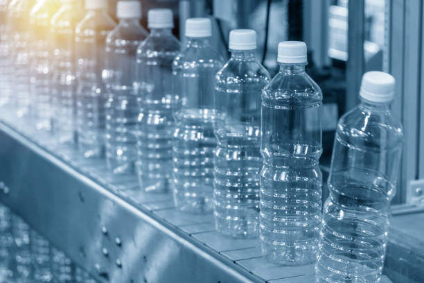 istock The empty plastic bottle in the conveyor belt. 1164731851