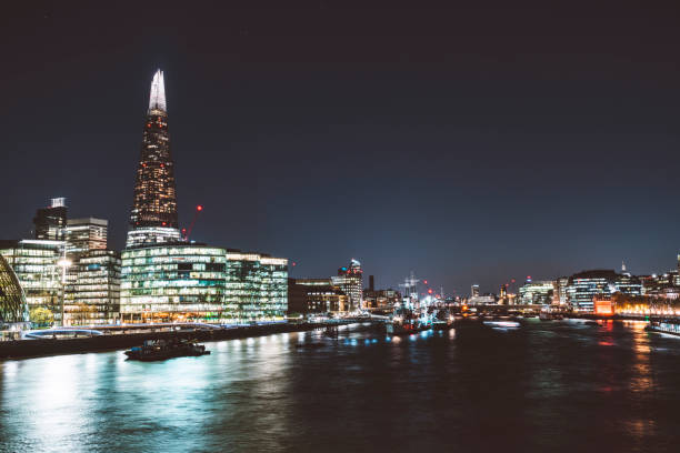 istock View of downtown London from the river Thames at night time 1164733078