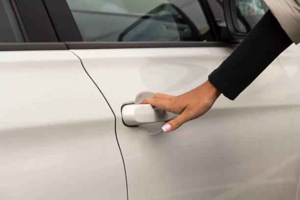 istock a girl in a white car 1164736531