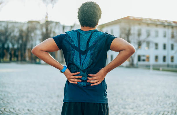 back pain. sport injury. - back rear view pain backache imagens e fotografias de stock