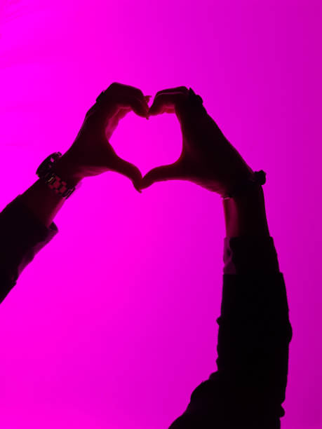 istock heart with hand on pink background - Schwetzingen Germany 1164741284