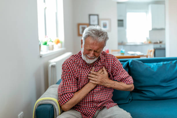 istock Senior man suffering from heart attack at home 1164743540