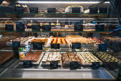 Liepaja, Latvia – July 13, 2019:  Various culinary products in a glass showcase