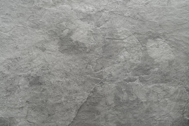 Photo of Light grey black slate stone background or texture