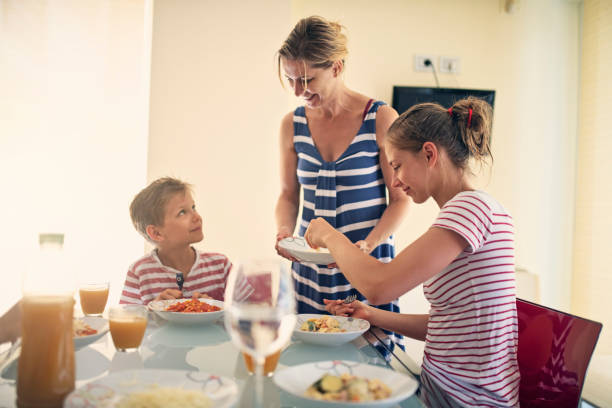 istock Family enjoying spaghetti lunch 1164747289