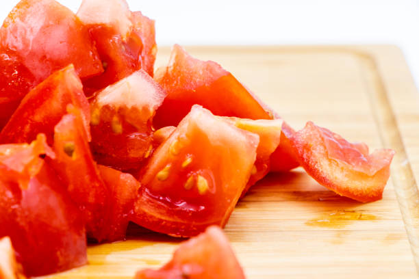 istock Colourful red tomatoes on a wooden cutting board. Calgary, Alberta, Canada 1164747718