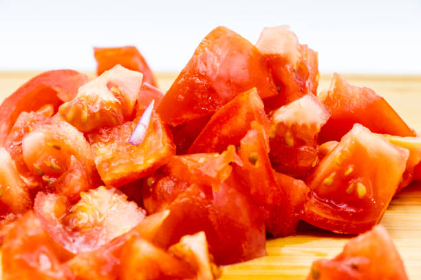 istock Colourful red tomatoes on a wooden cutting board. Calgary, Alberta, Canada 1164749514