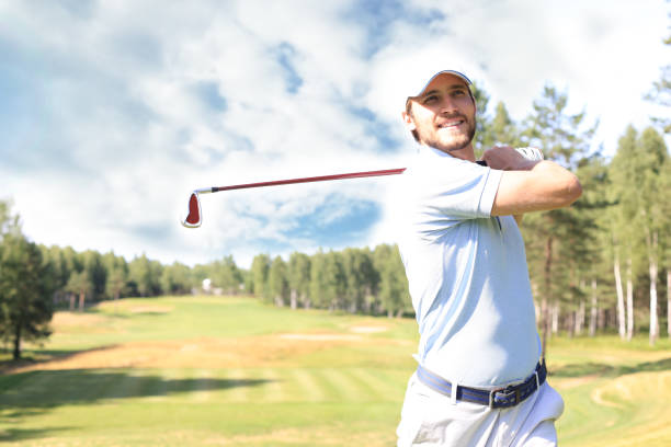 istock Golfer hitting golf shot with club on course while on summer vacation. 1164749816