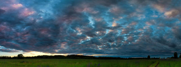 istock Panorama of the sky with beautiful colored whimsical clouds 1164750727