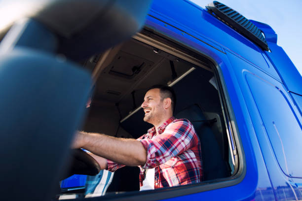 istock Truck driver driving his truck. 1164750865