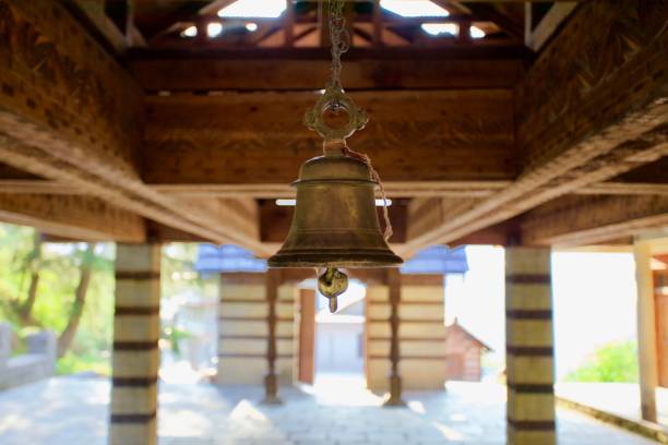 Old bell in ancient buddhist pagoda in North Indian Himalayan mountains. Ancient buddhist temple in Himalaya. Traditional buddhist architecture. Pagoda in Indian Himalayan mountains. Wooden Buddhist Pagoda interior. Hiking in Himalayan mountains. Buddhist symbols. Buddhist Pagoda in sunny day. Unesco world heritage. World famous landmarks.