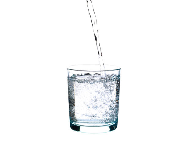 istock water splashing from glass isolated on white background 1164757438