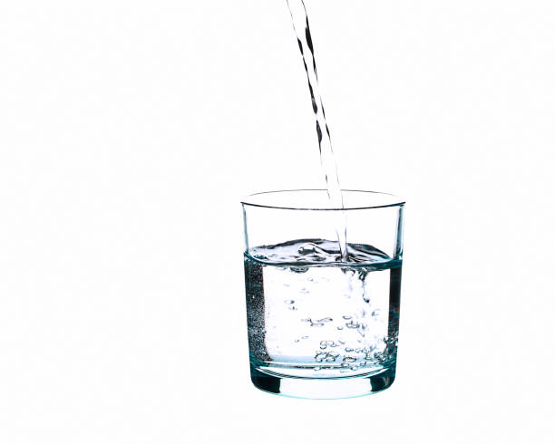 istock water splashing from glass isolated on white background 1164757455