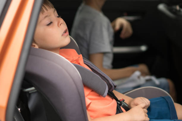 istock Little boy sleeping in car trip 1164757628