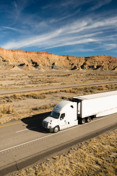 istock Dramatic Sky High Road Big Rig OTR Transportation 1164758960