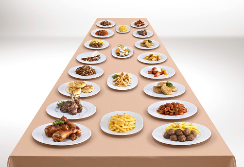 Variety of delicious dishes on a long table