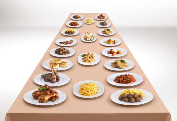 Feast table Variety of delicious dishes on a long table big plate of food stock pictures, royalty-free photos & images
