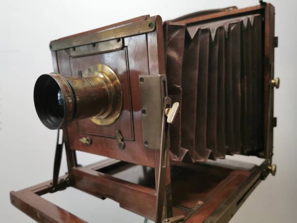 istock wood and bronze old camera 1164760356