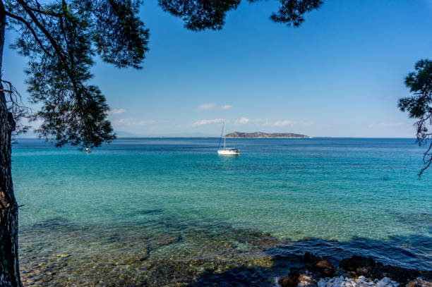 istock Sailboat anchored by the seashore at sea 1164760794