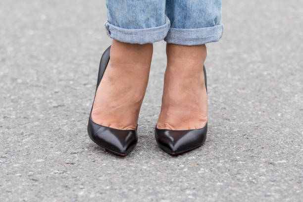 istock girls feet in shoes 1164761932