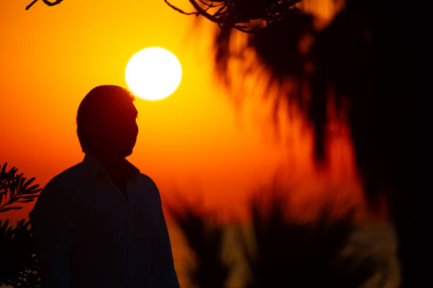 Man enjoying colorful sunset