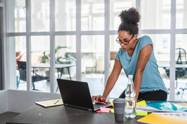 istock Focused African Businesswoman Working on Laptop 1164762989