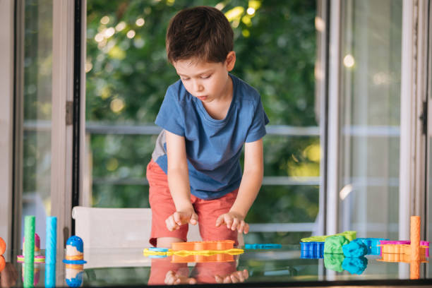 istock Preschool boy playing with child's play clay 1164764400