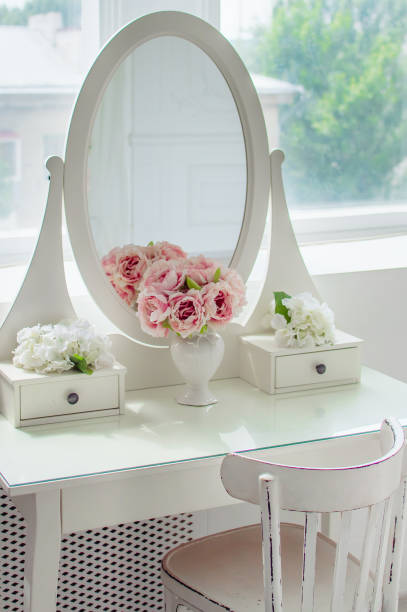 istock A beautiful white mirror on the table. Elegant bright interior. 1164765844