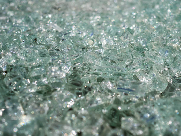 fragments of greenish glass. small and sharp pieces of broken glass - broken glass green shattered glass imagens e fotografias de stock